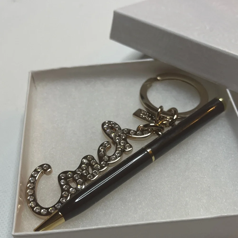 Coach Gold Rhinestone Keychain with a Black Coach Pen